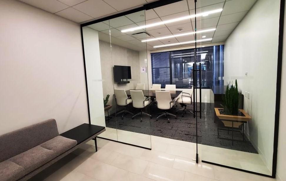 Glass walled presentation room conveniently located adjacent to the lobby