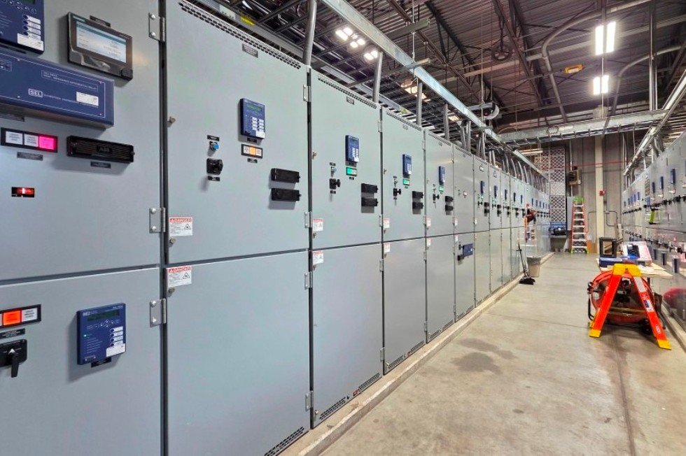 Service entry / utility switchgear  (l) and generator paralleling switchgear (r) at the ready for commissioning. 