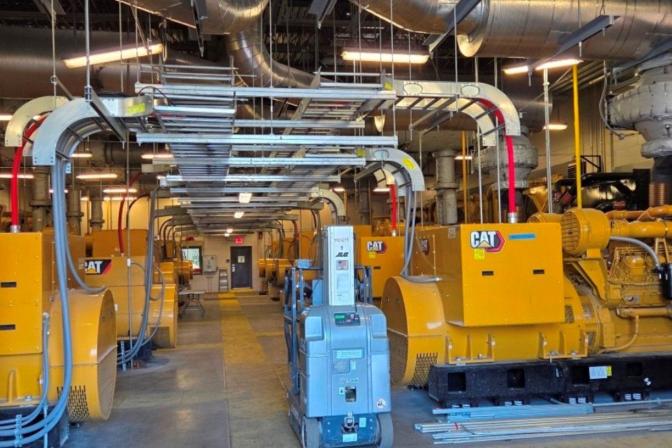  All cabling installed and organized on ladder rack. New generators in foreground, compartmentalized control room and gear in background. 