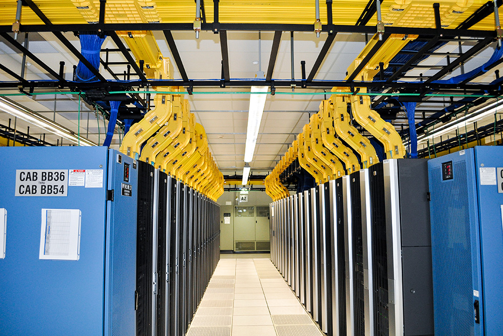 Color coded redundant remote power panels are located at each end of the equipment rows.  Power distribution units are organized around the perimeter, with the CRAH units located in a secure mechanical gallery.