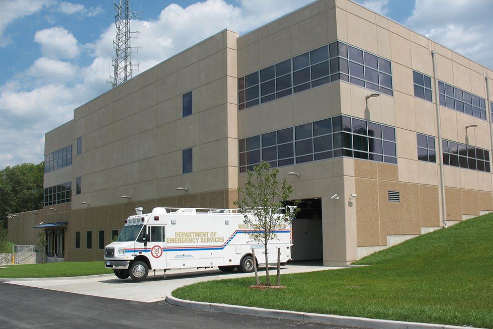 Sloping site provides for grade level service entry at the rear of the structure