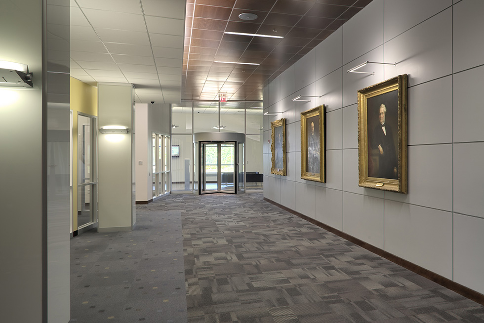 The lobby and circulation spine prominently displays artifacts, historical documents, images, and artwork from throughout the organizations more than 100 year history 