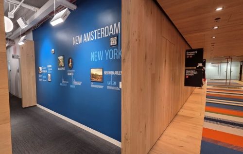 Natural wood entry gallery pay homage to the history of the Dutch and America