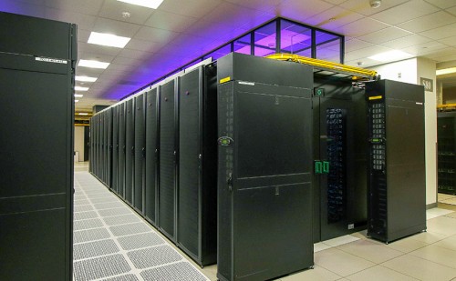 High density production POD with end-of-row remote power panels and illuminated hot aisle containment clerestory